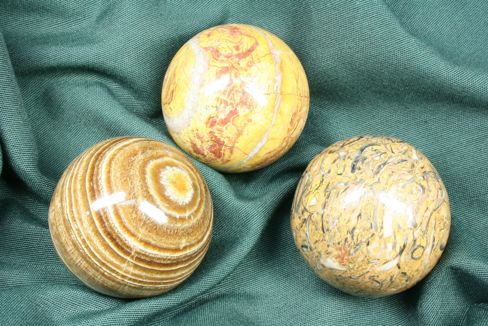 Antiques of trio brown stone balls different styles