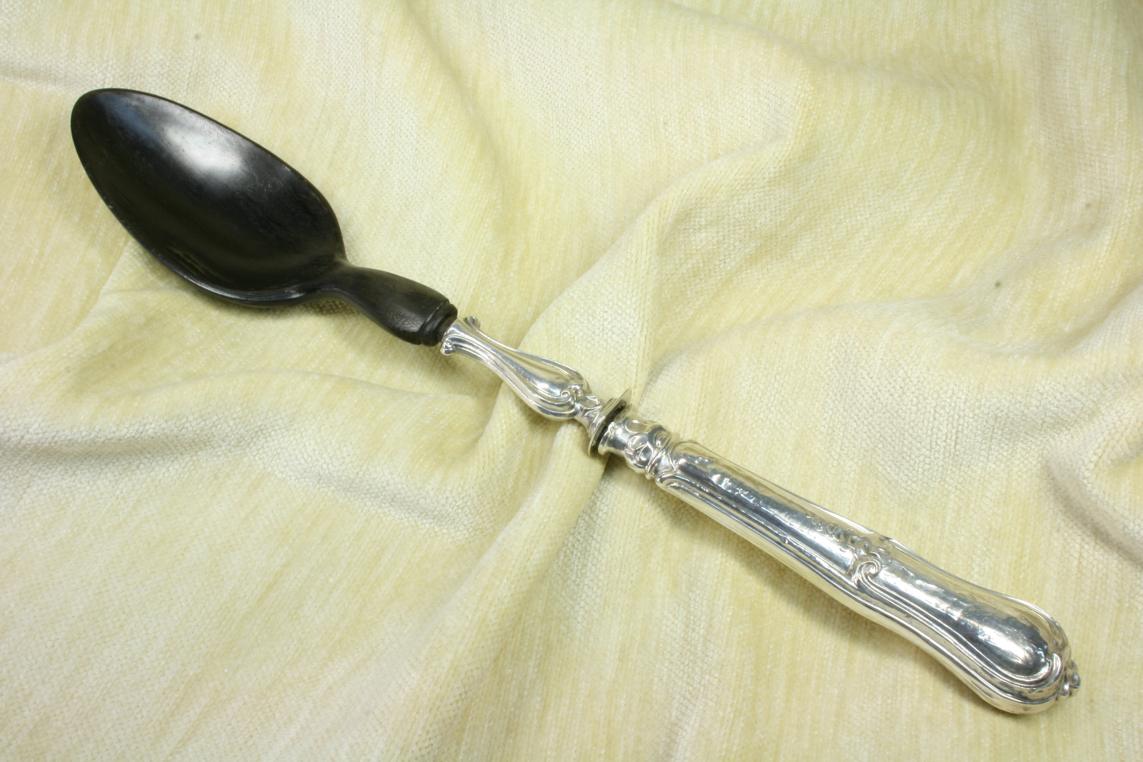 Antiques of serving ladle silver and wood