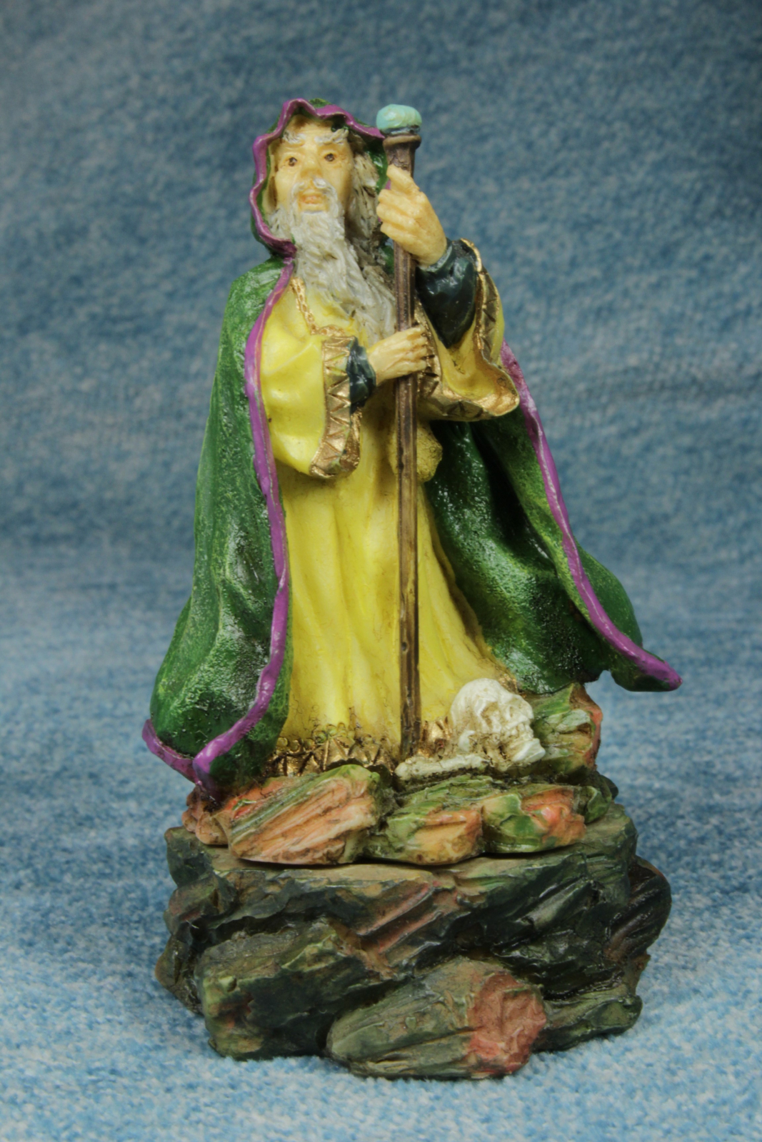 Antiques of magician with stick of resin figure