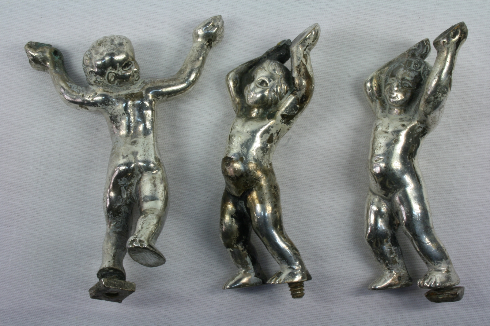 Antiques of trio of children dancing musicians