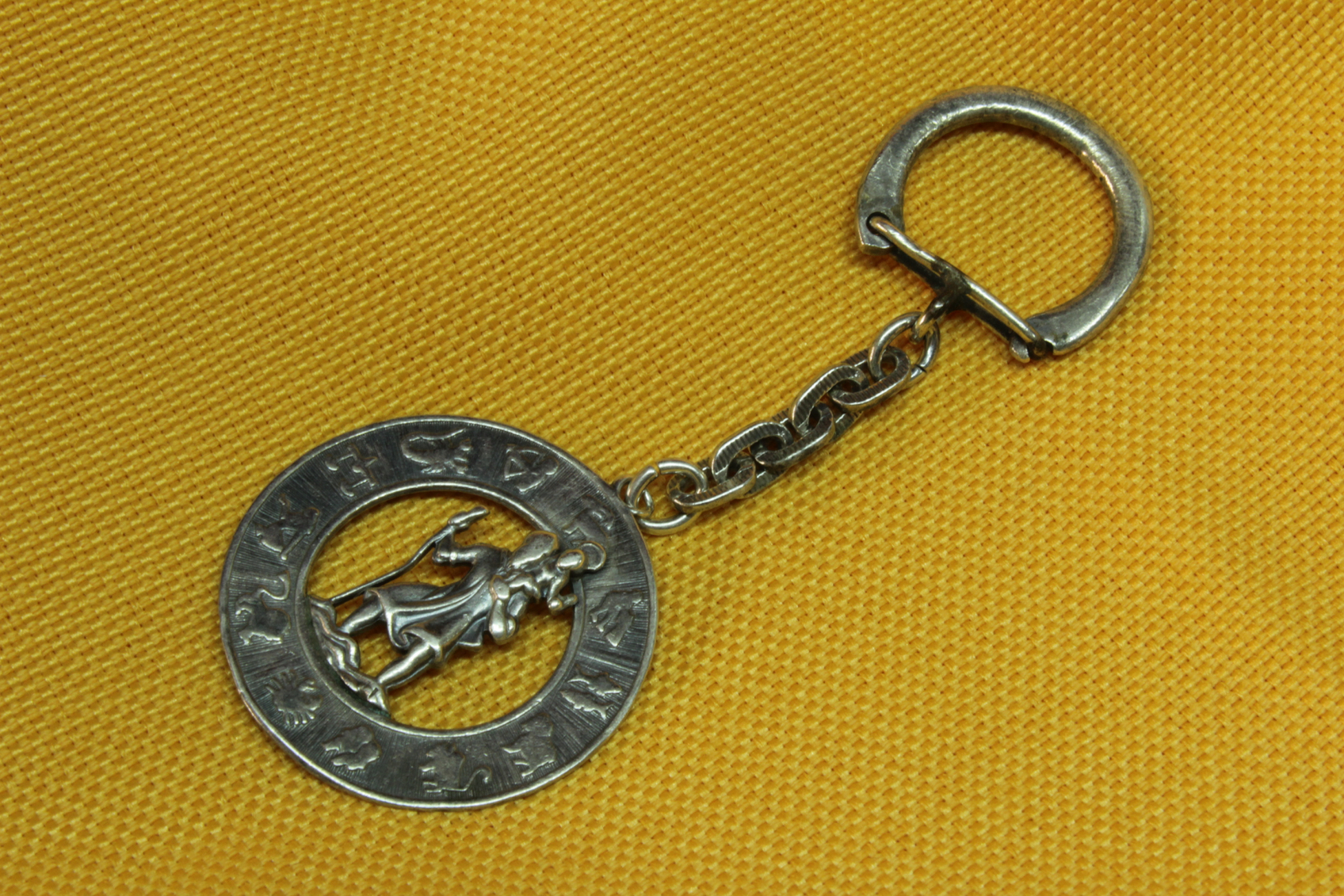 Antiques of san cristobal with zodiac keychain