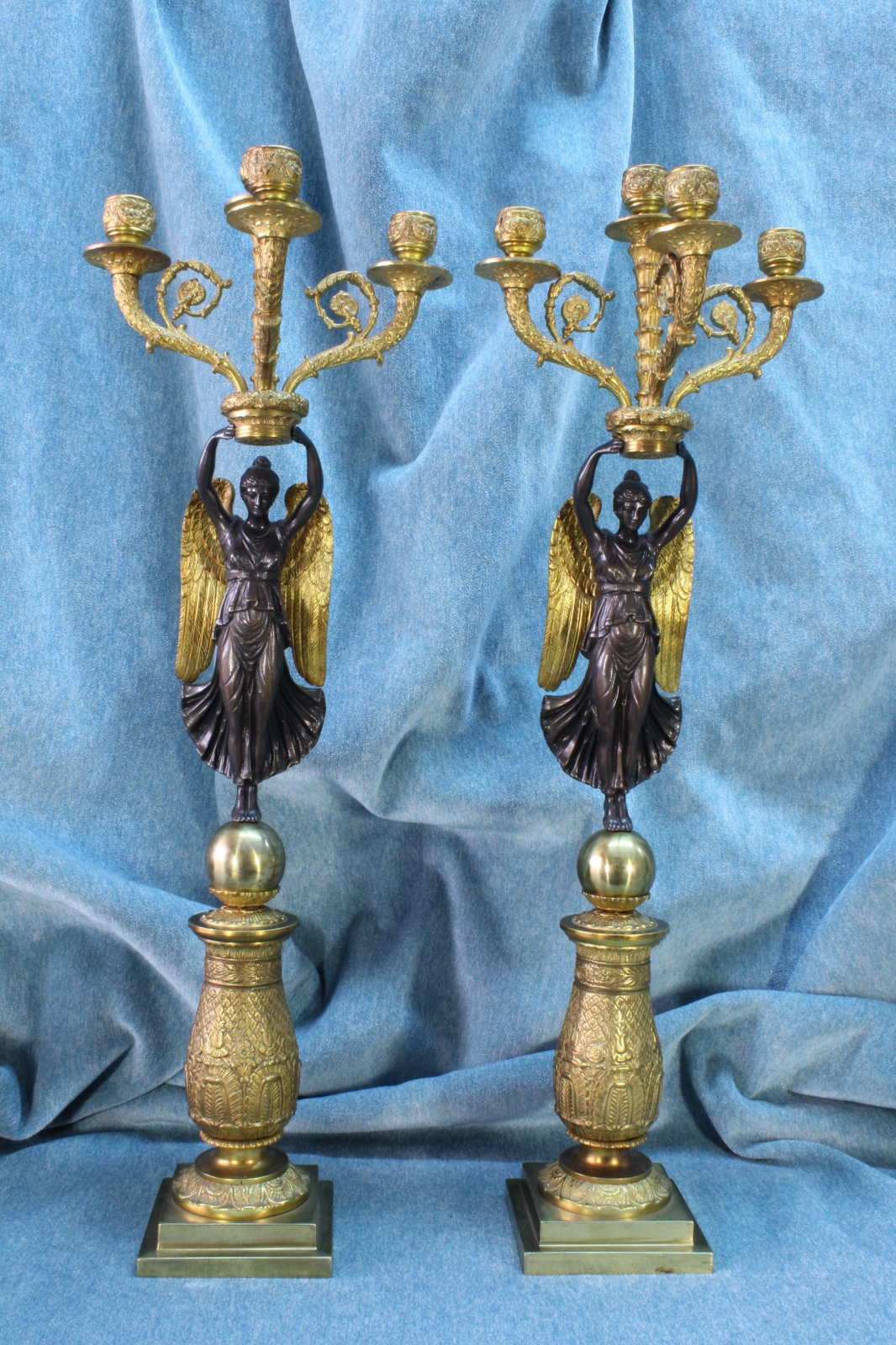 Antiques of pair of empire style candlesticks