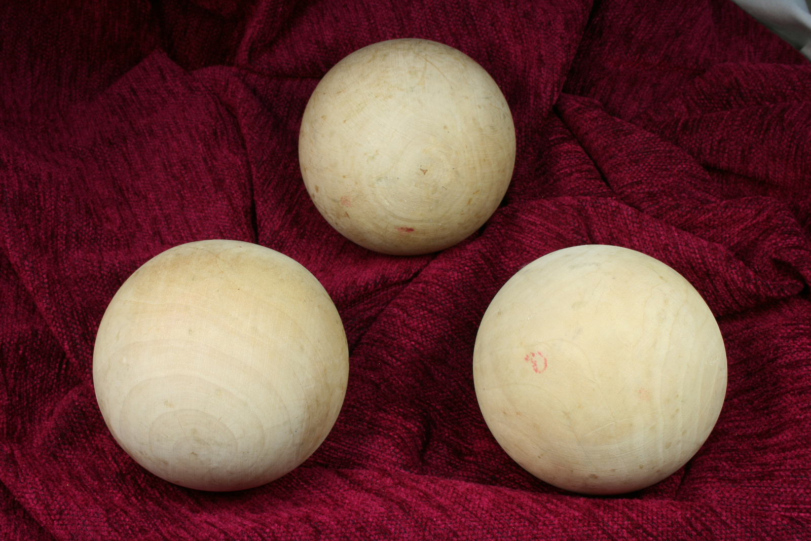 Antiques of trio of wooden balls three large wooden balls