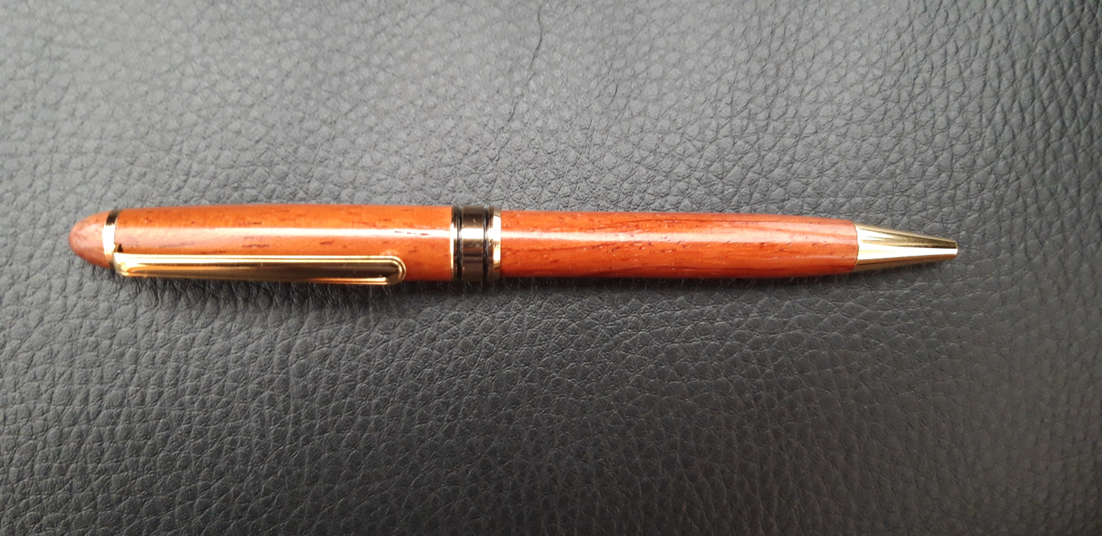 Antiques of brown and gold ball pen