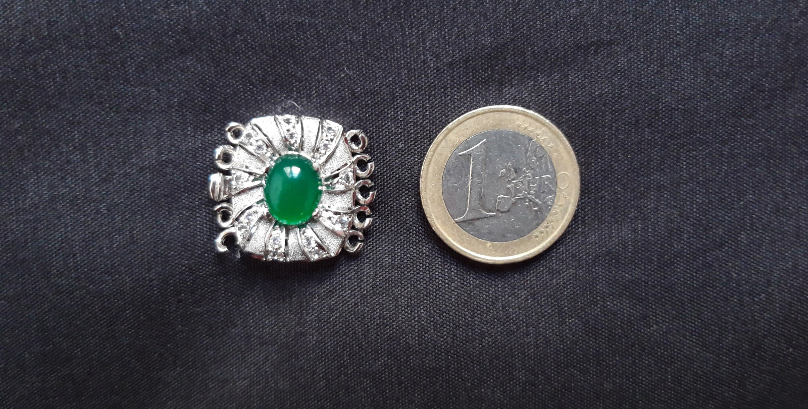 Antiques of pendant with green stone and zircons vintage