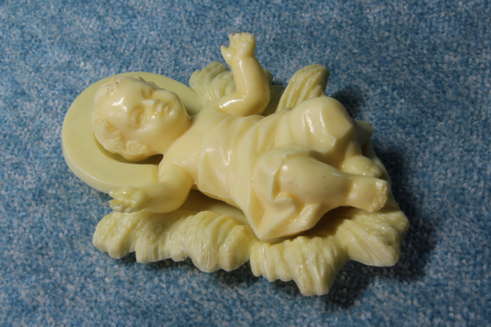 Antiques of baby jesus in the cradle plastic