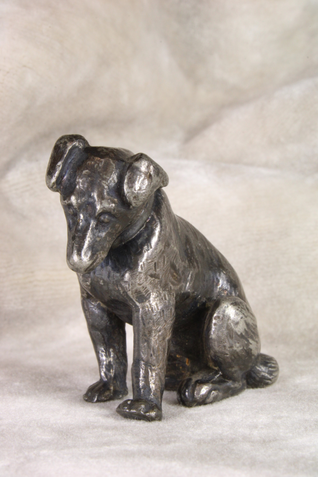 Antiques of sitting puppy miniature