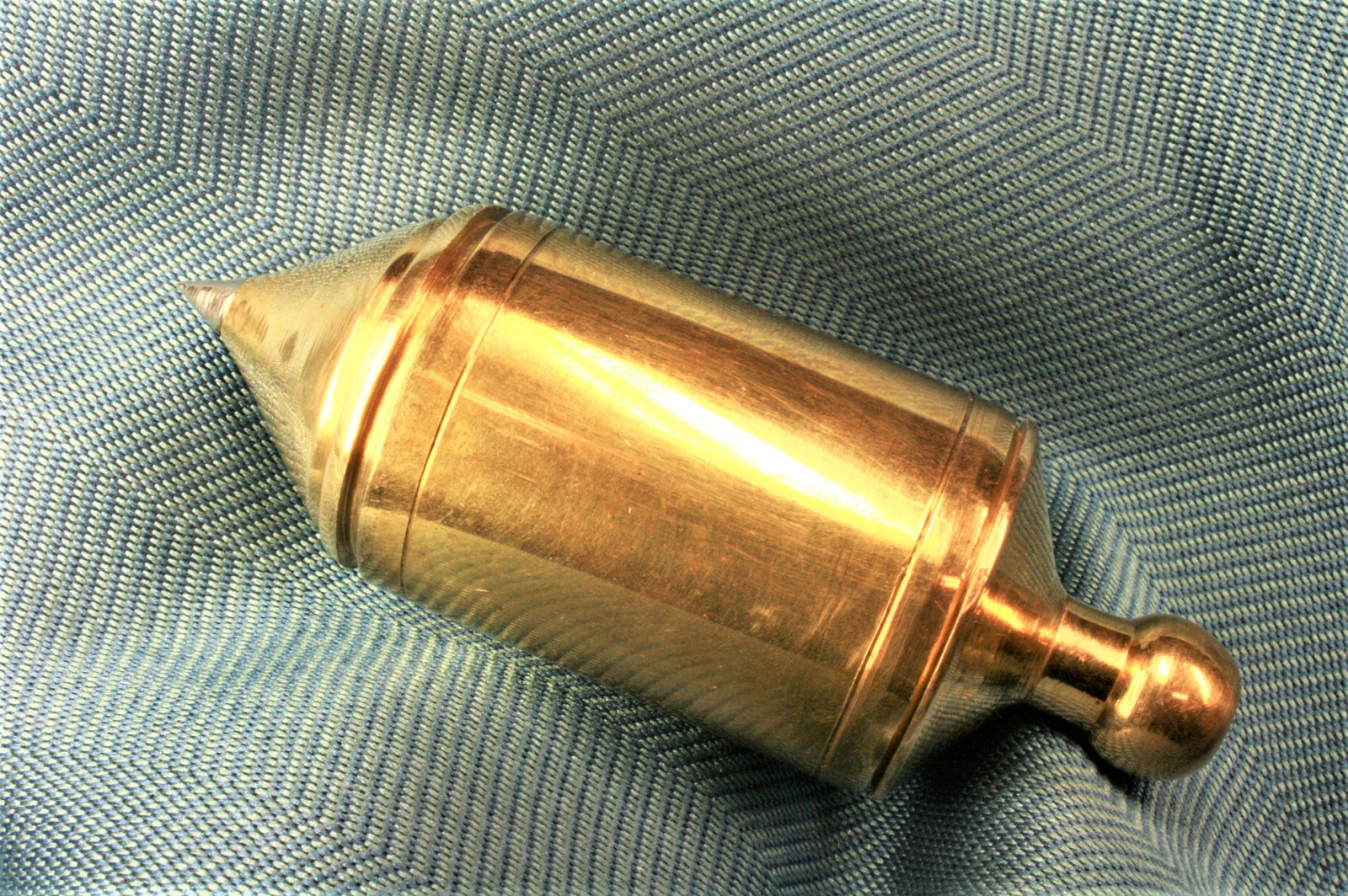 Antiques of hollow plumb bob construction brass