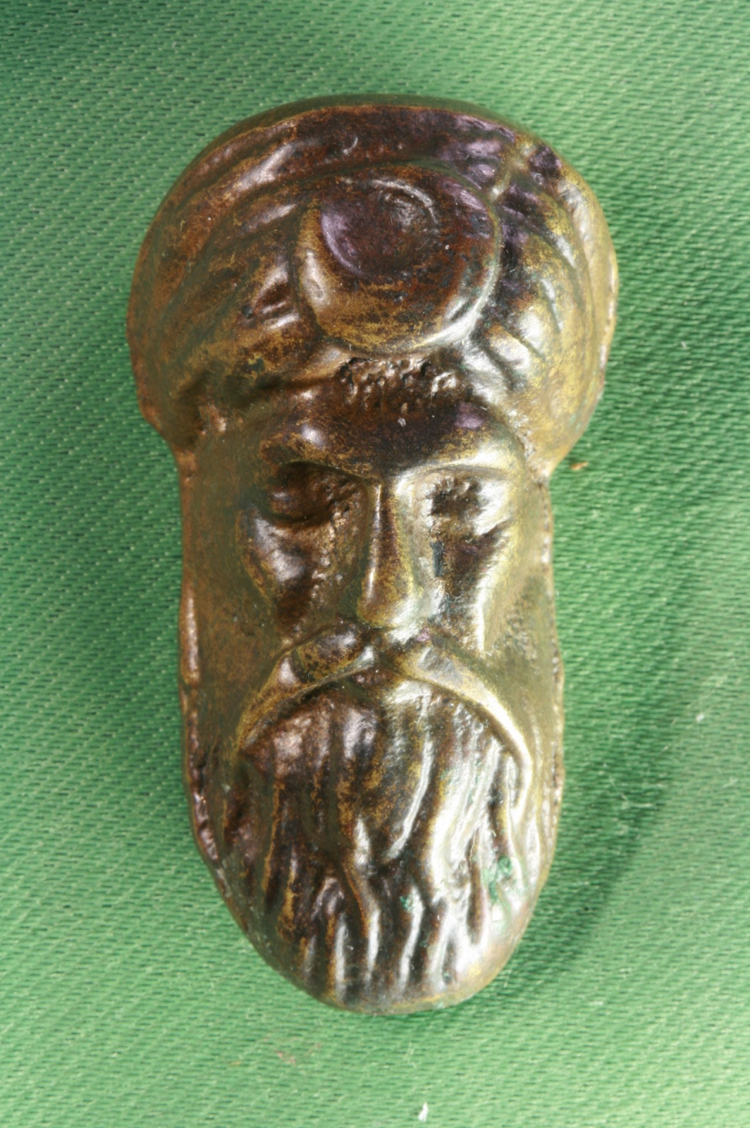 Antiques of arabian bronze mask amulet