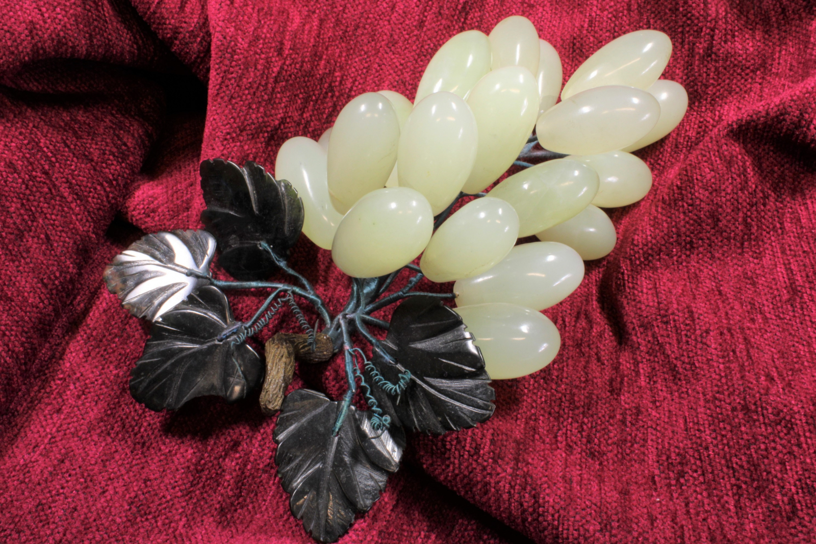 Antiques of cluster of whitish jade grapes