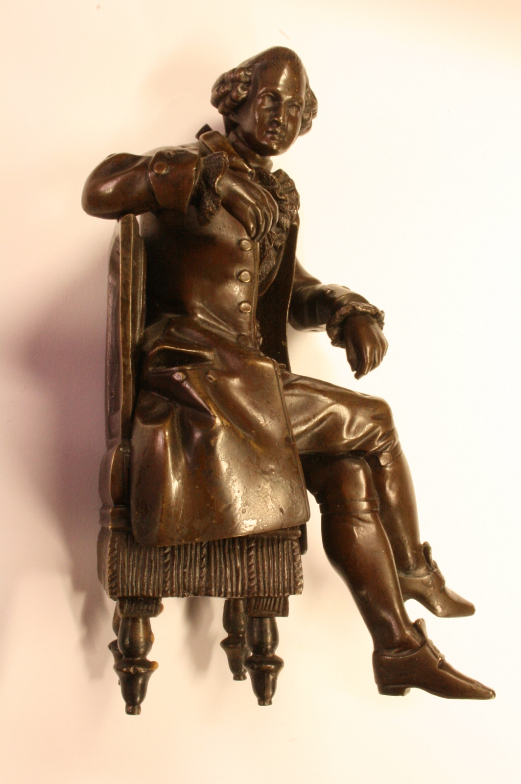 Antiques of gentleman sitting bronze noble