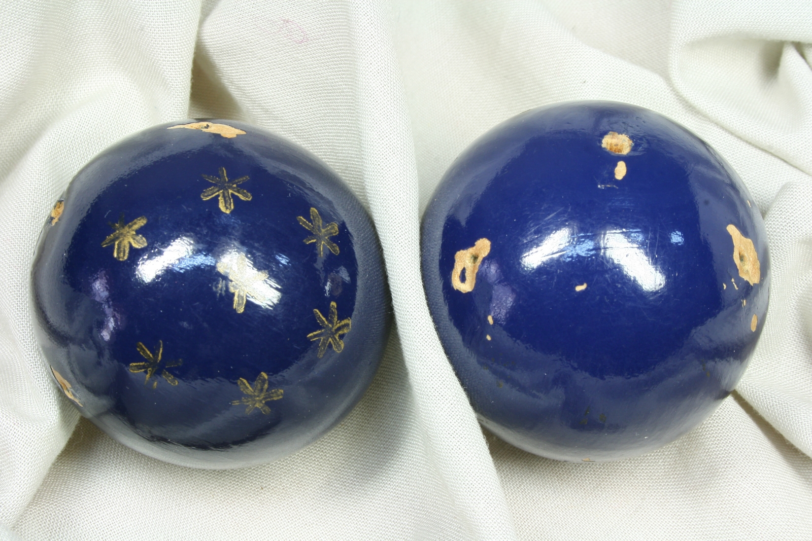 Antiques of pair of painted wooden balls