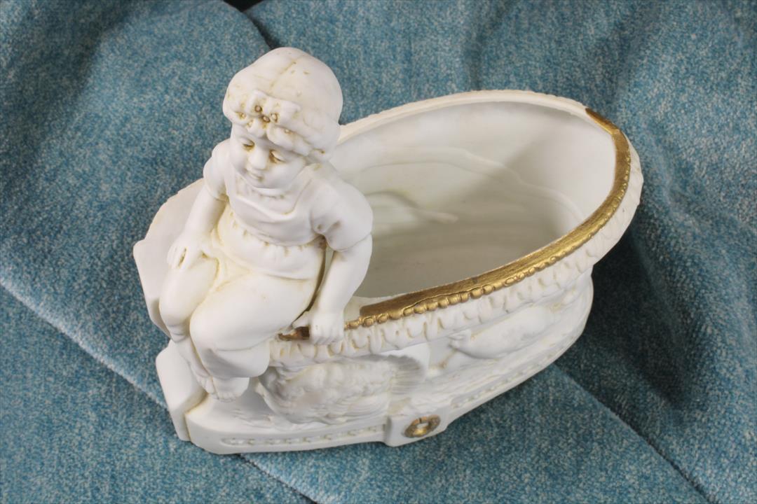 Antiques of biscuit figure seated child flower bowl