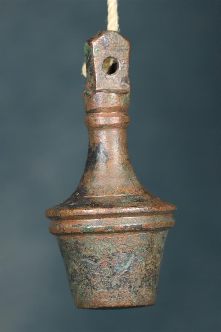 Antiques of bronze plumb bob perico