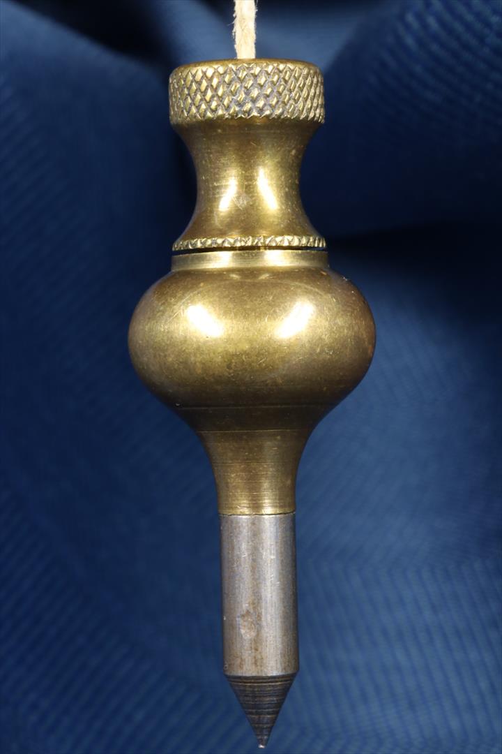 Antiques of perico bronze and steel plumb bob pera