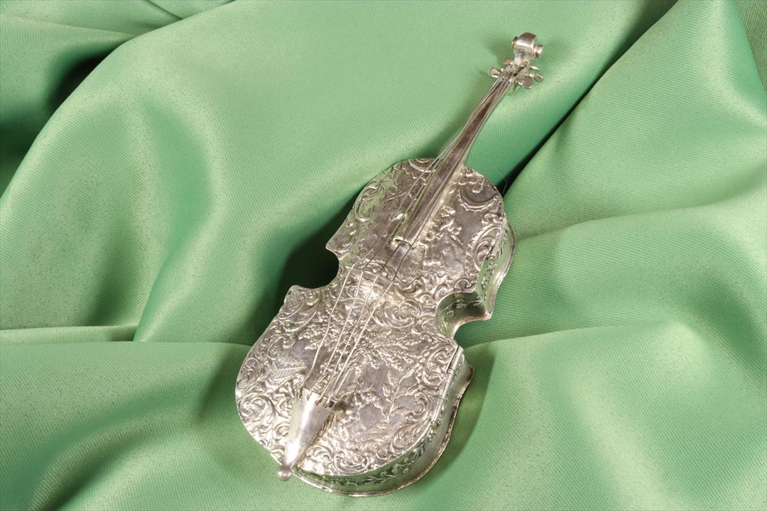 Antiques of silver cello box with basrelief