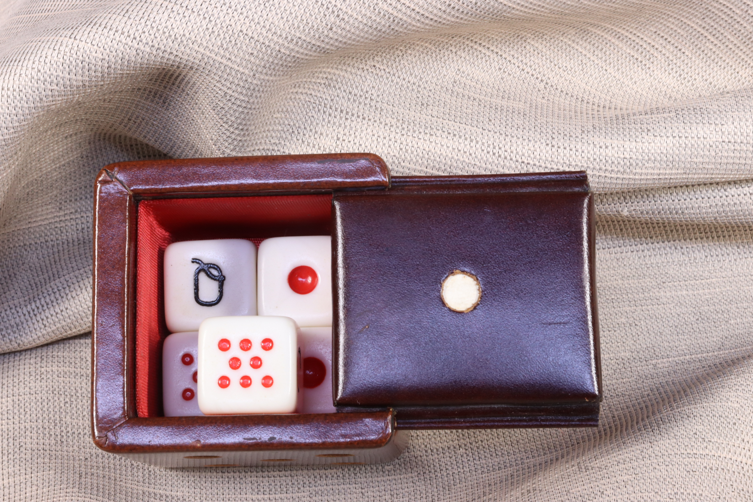 Antiques of small box in the shape of a dice with dice inside