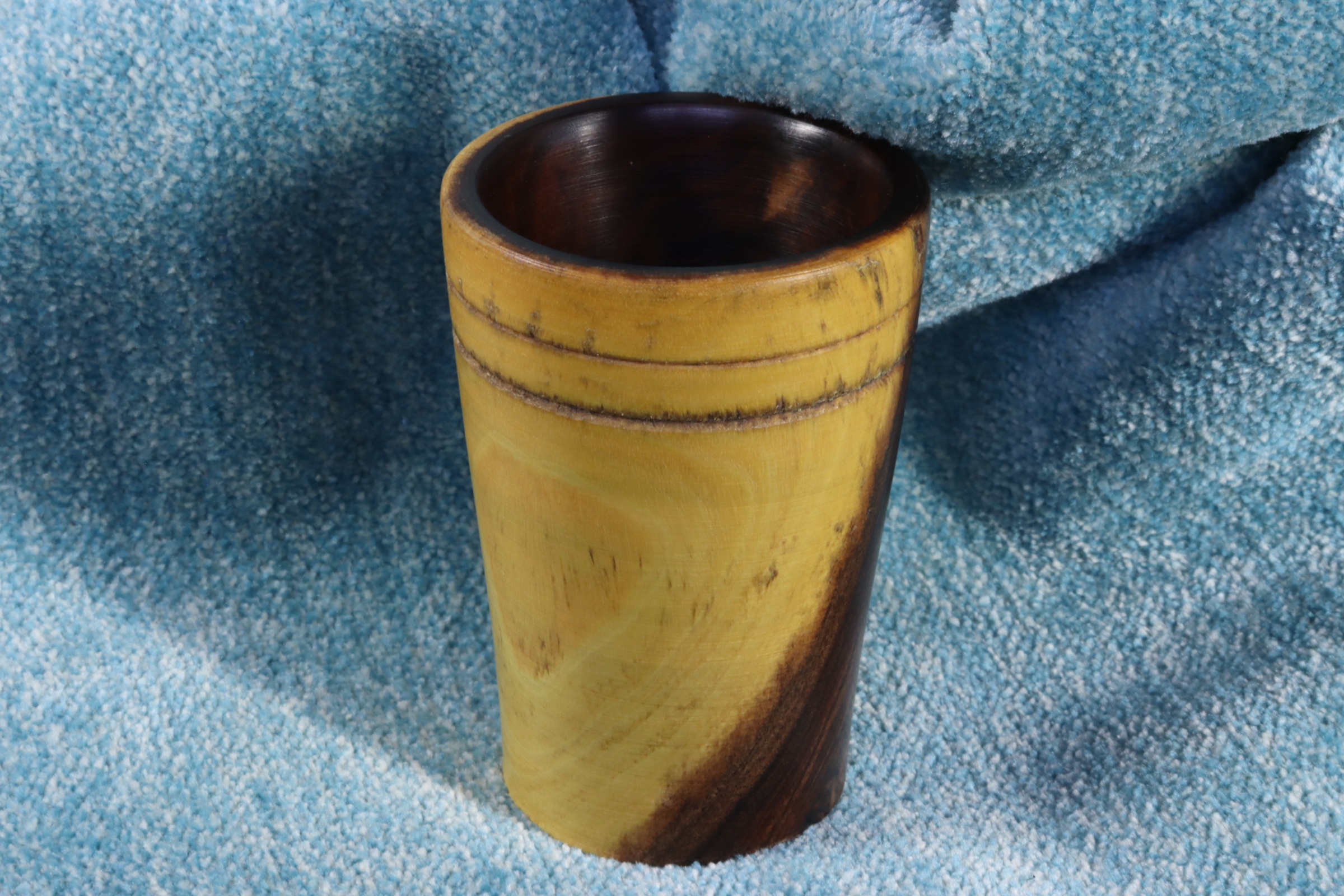 Antiques of small wooden dice cup with dice