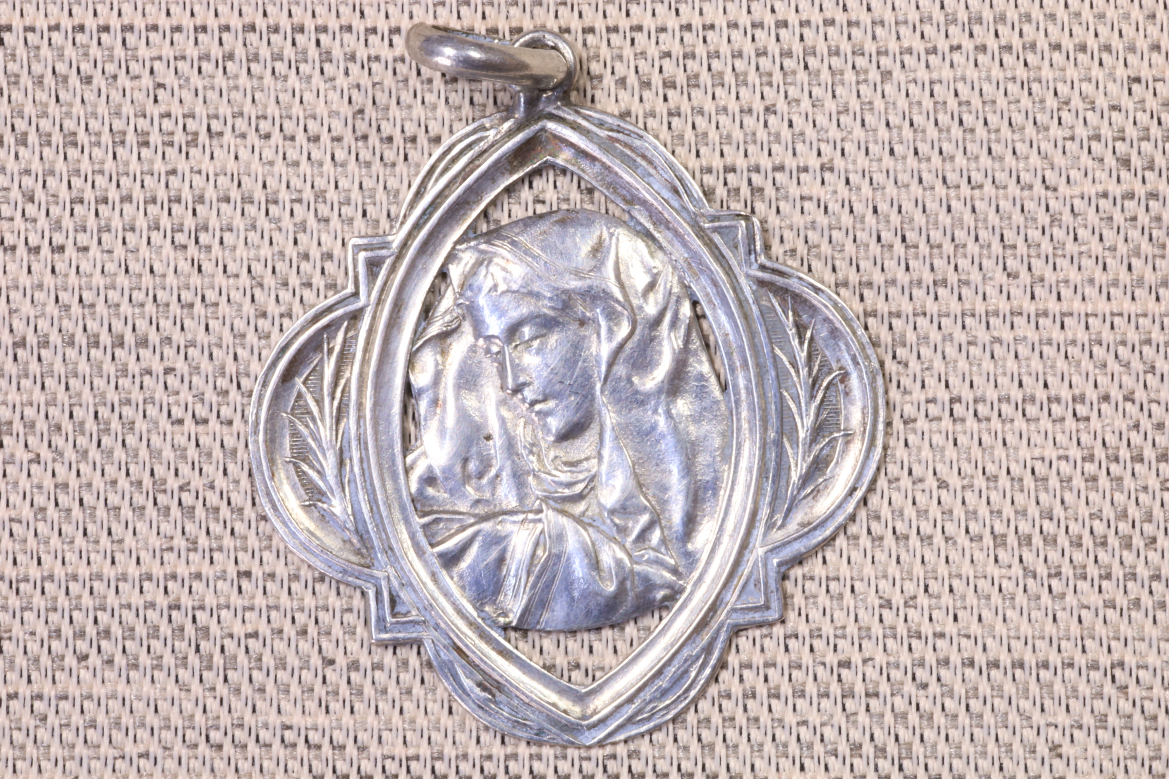 Antiques of virgin oval medal art deco style silver