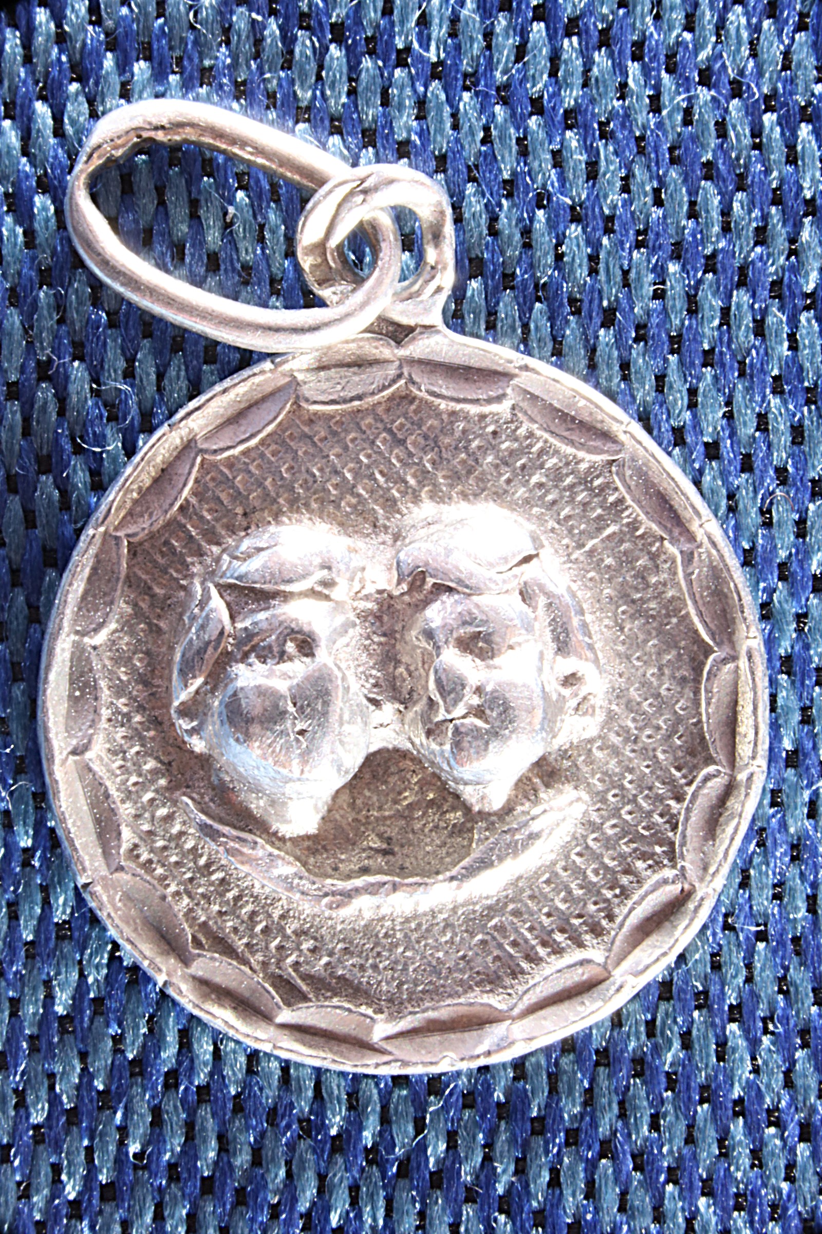 Antiques of small medal angel heads silver