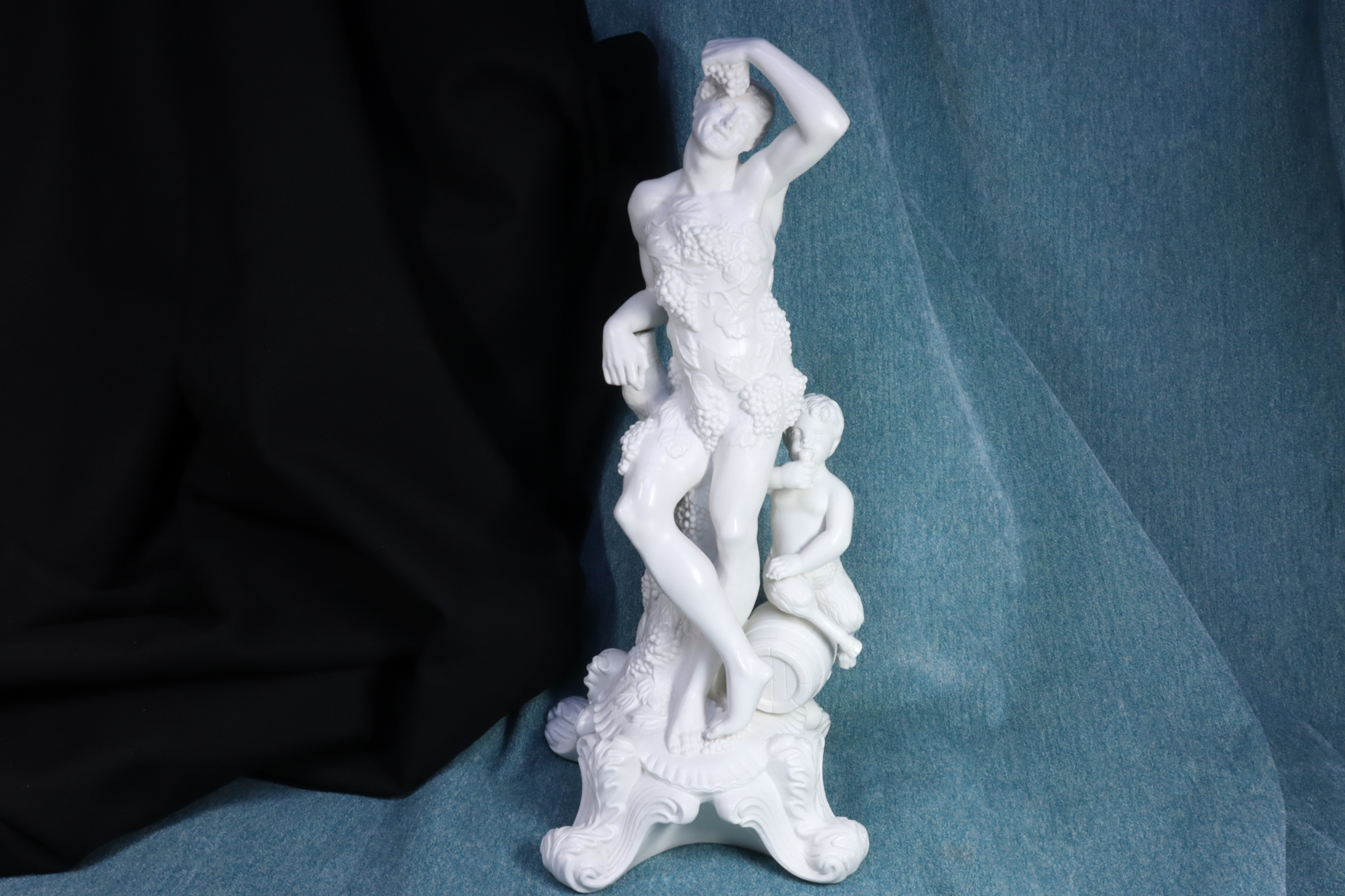 Antiques of biscuit sculpture man with faun autumn