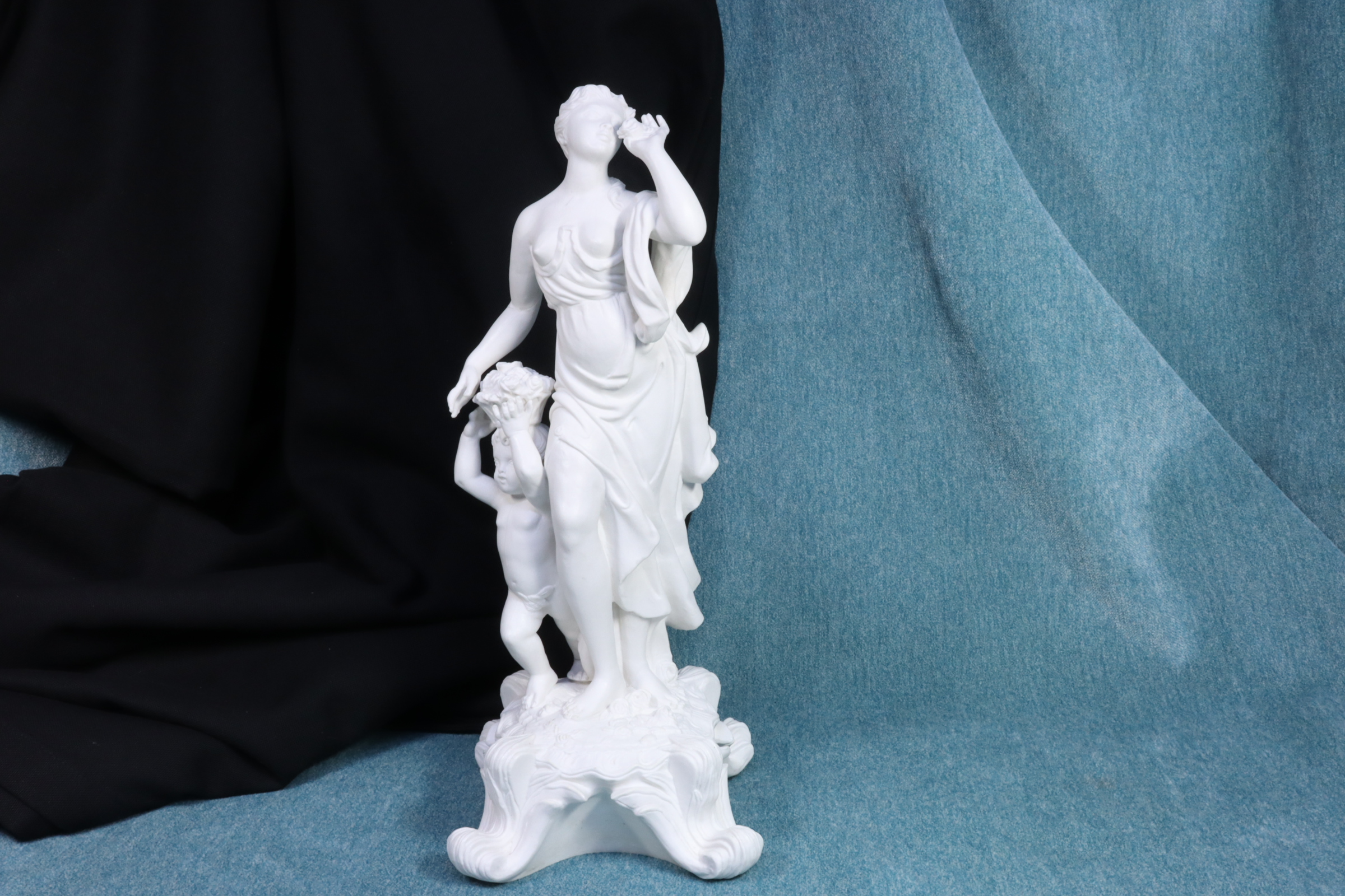 Antiques of biscuit sculpture woman with child spring